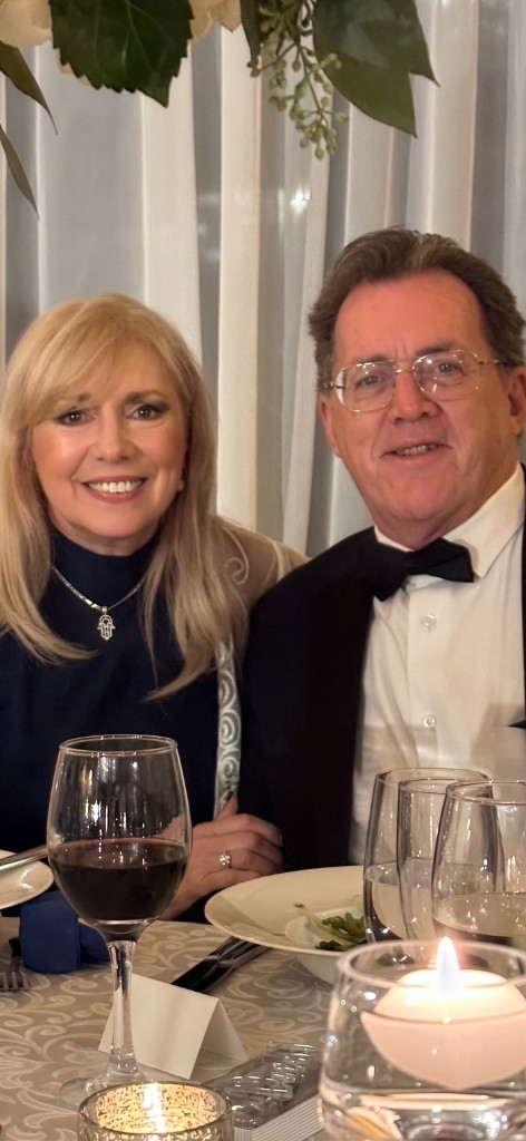 Donald and Judy Cassidy at a formal dinner